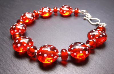 Lampwork glass bead and sterling silver bracelet by Laura Sparling Lampwork glass bead and sterling silver bracelet by Laura Sparling