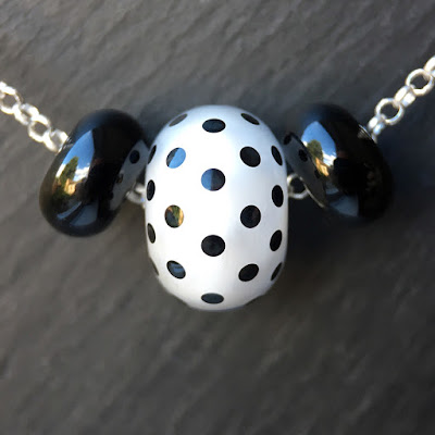 Lampwork glass and sterling silver necklace by Laura Sparling Lampwork glass and sterling silver necklace by Laura Sparling