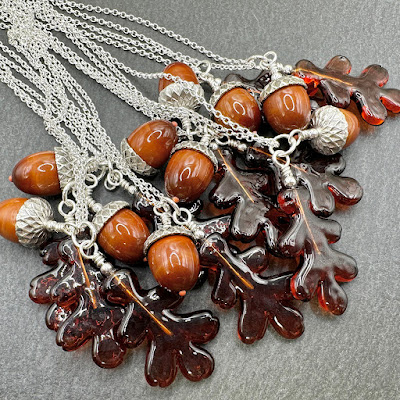 Sterling silver and lampwork glass 'Acorn and Oak Leaf' necklaces by Laura Sparling Sterling silver and lampwork glass 'Acorn and Oak Leaf' necklaces by Laura Sparling