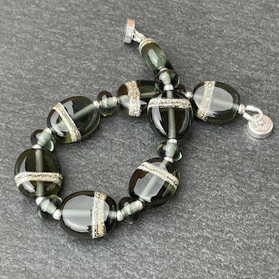 Handmade lampwork glass bead bracelet by Laura Sparling Handmade lampwork glass bead bracelet by Laura Sparling