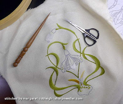 Preparing to Remove Some Stitching Preparing to remove some embroidery with a laying tool and some scissors
