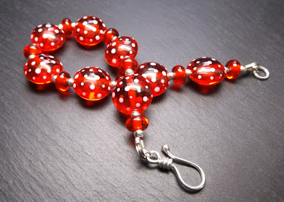 Lampwork glass bead and sterling silver bracelet by Laura Sparling Lampwork glass bead and sterling silver bracelet by Laura Sparling