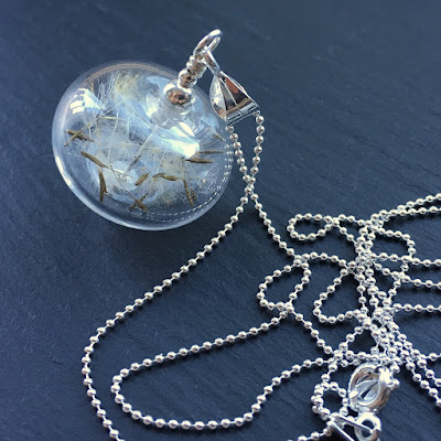 Blown lampwork glass bead and dandelion seed necklace by Laura Sparling Blown lampwork glass bead and dandelion seed necklace by Laura Sparling
