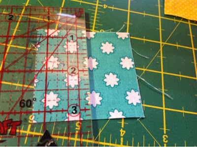 cut 2.5" squares in half cut 2.5" squares in half