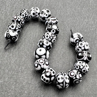 Handmade lampwork glass black and white beads by Laura Sparling Handmade lampwork glass black and white beads by Laura Sparling
