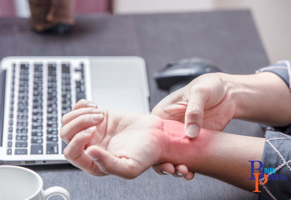 A person holds their wrist in pain near a laptop, a red area highlighting the discomfort. Many on Long Island seek treatments for such issues, exploring solutions beyond cosmetic procedures. A person holds their wrist in pain near a laptop, a red area highlighting the discomfort. Many on Long Island seek treatments for such issues, exploring solutions beyond cosmetic procedures.