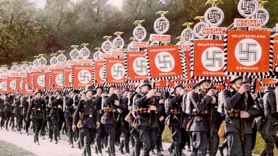 Nazi Germany, Nazi SS troops marching with victory standards at the Party Day rally in Nuremberg, Germany, 1933. (Schutzstaffel, Nazi Party, Nurnberg)