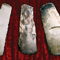 Three flint axes from the stone age. (prehistoric, tools, early humans, culture, archaeology, implements)