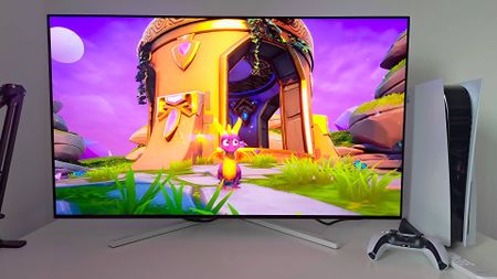 Philips Evnia 42M2N8900 monitor with Spyro the Dragon gameplay on screen