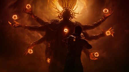 Saros screenshot featuring the main character and am imposing monster in the background with a swirling void in its chest and multiple arms with balls of fire