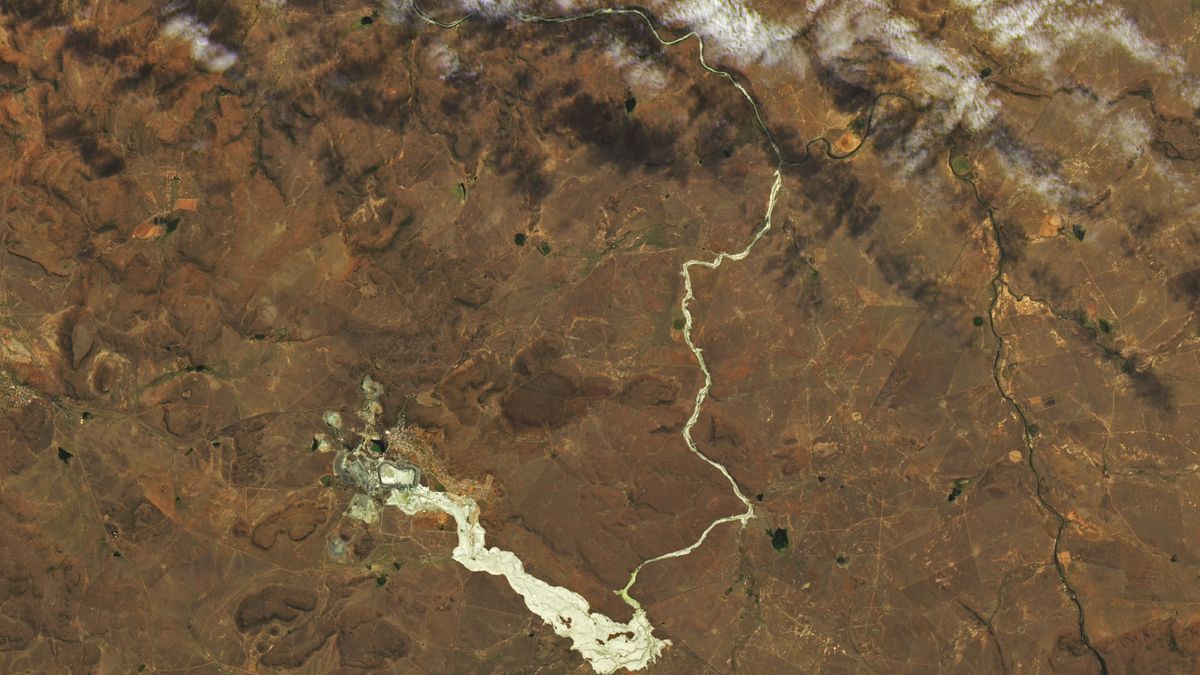 A satellite photo showing a winding river of gold coming from a town in south africa