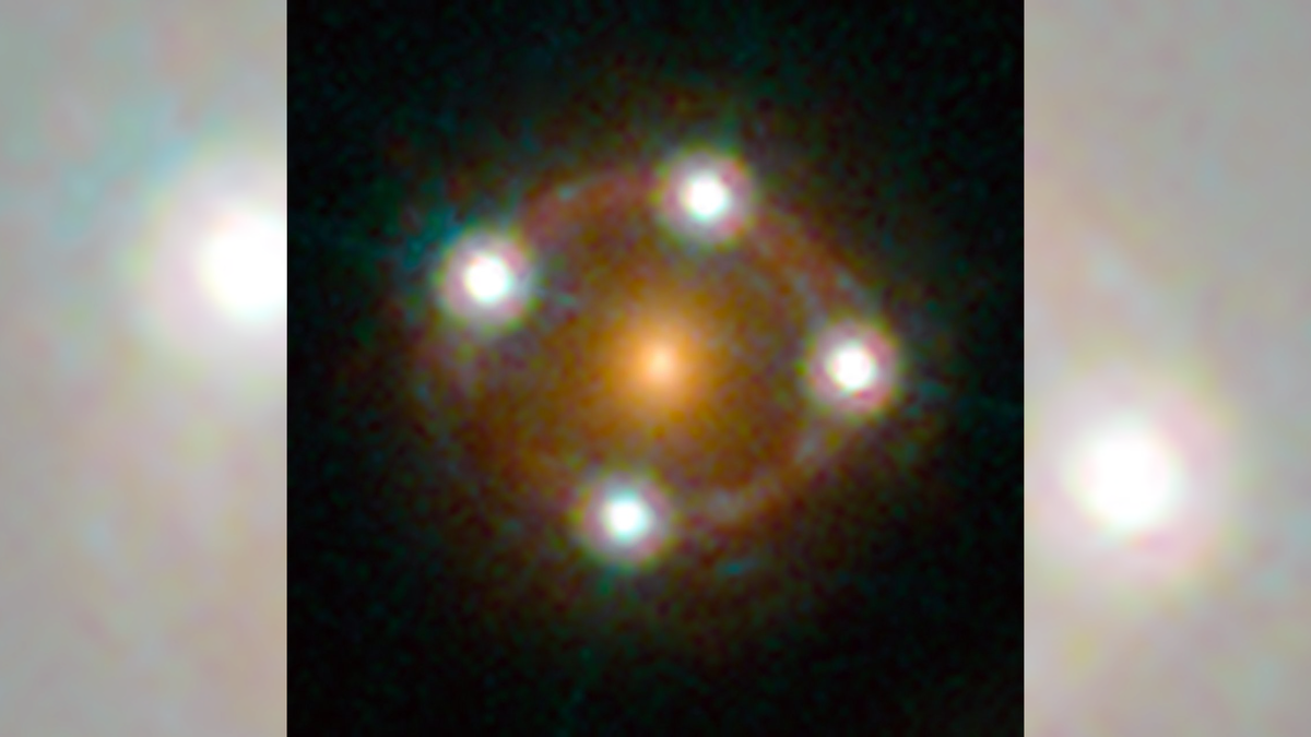 A bright, orange circle in the center of a ring of light. Four bright white spots form a cross shape on the circle&#039;s perimeter