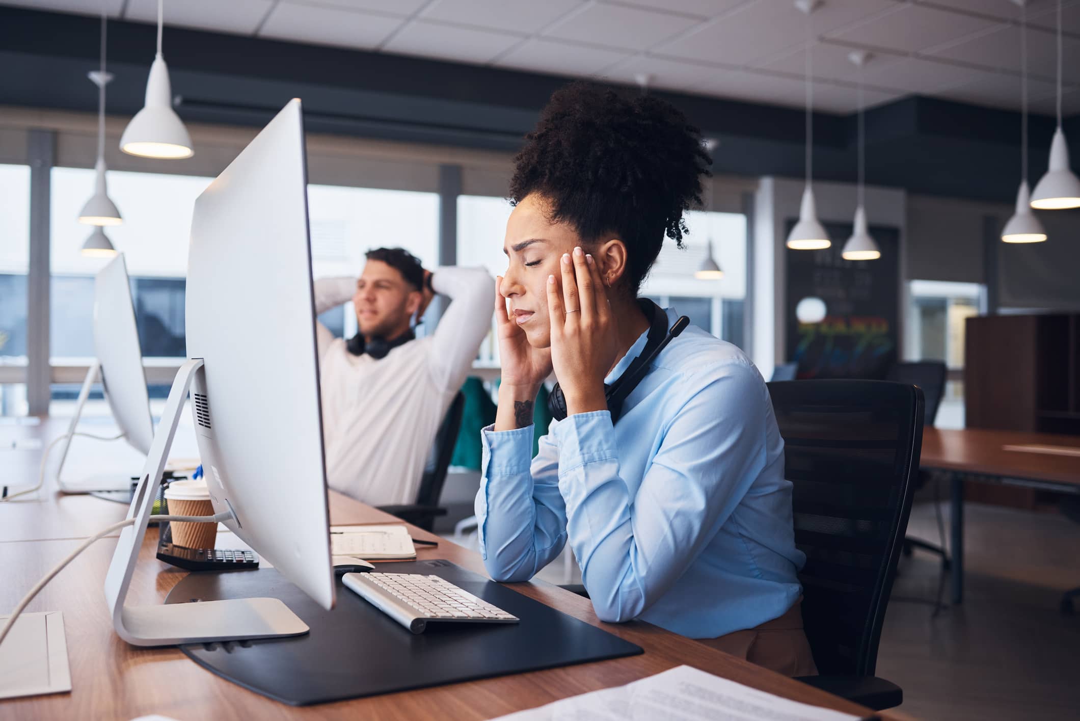 Woman looking frustrated in front of computer