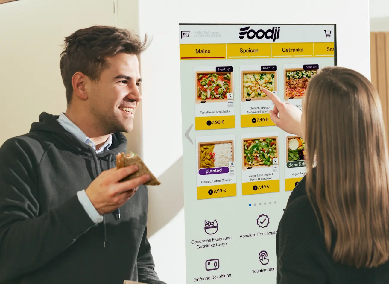 Foodji - food vending machine - talking in front of the vending machine