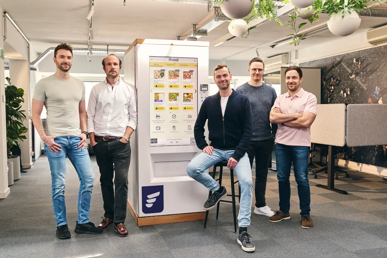 Foodji team in front of food vending machine