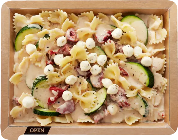 Farfalle caprese with zucchinis