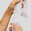 A person reviewing a receipt