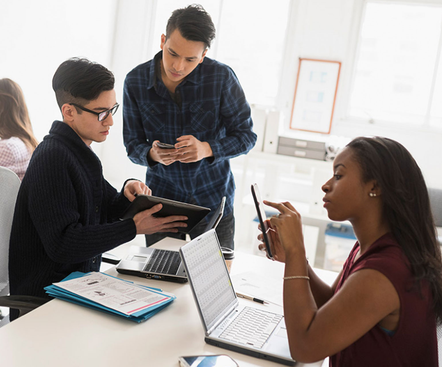 UX researchers testing devices