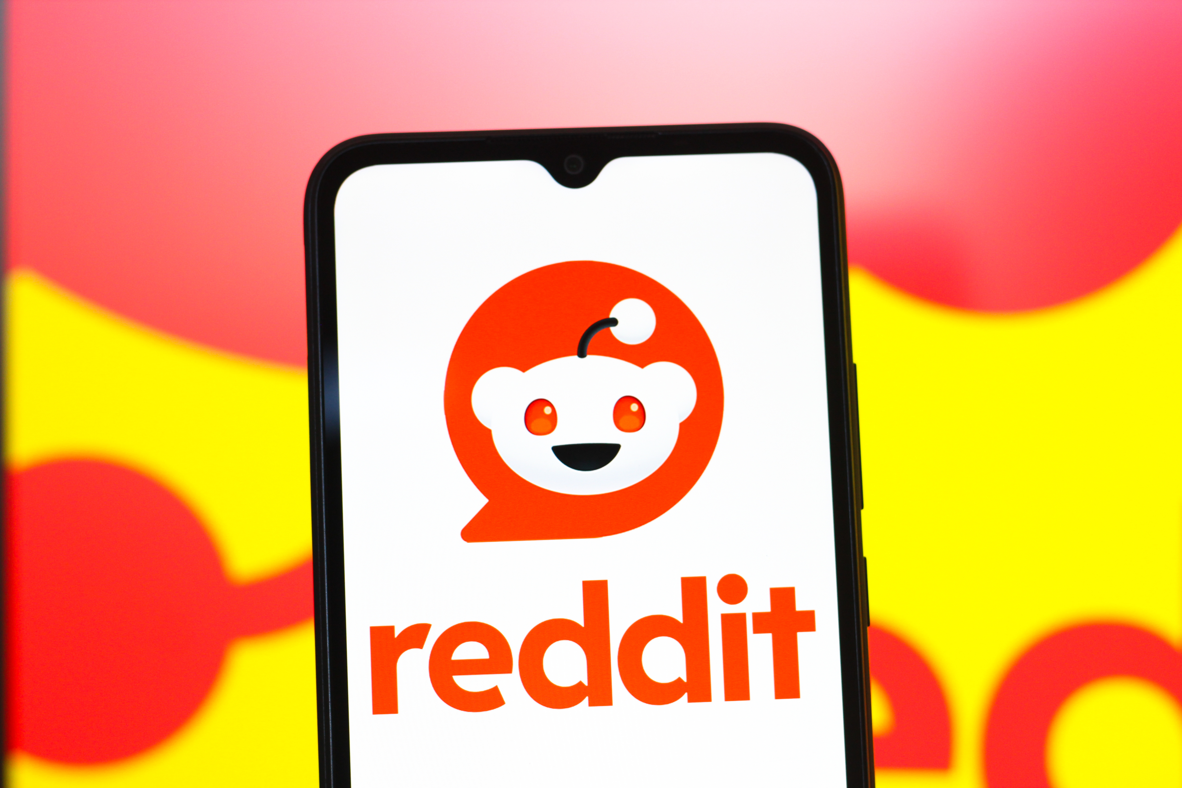 In this photo illustration, the Reddit logo is seen...