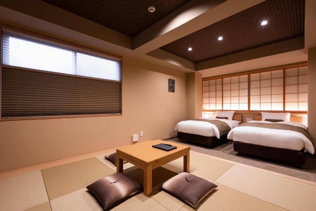 A bed or beds in a room at Rinn Kitagomon