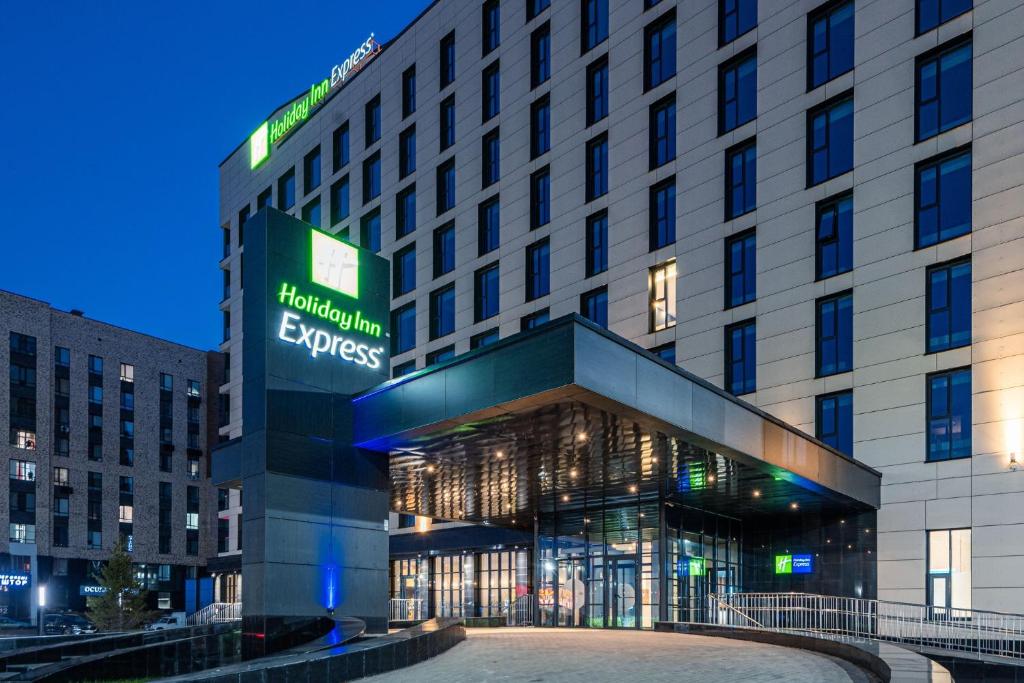 a hotel building with a sign that reads hilton express at Holiday Inn Express - Astana - Turan by IHG in Astana