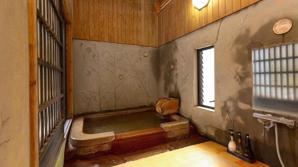 Kylpyhuone majoituspaikassa Kannawa Onsen Zekkei no Yado Sakuratei - Vacation STAY 50714v