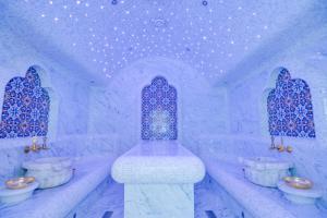 an ice room with three sinks and two windows at The ONE Hotel Astana in Astana