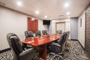 a conference room with a long table and leather chairs at Wingate by Wyndham, Universal Studios - Free Theme Park Shuttle in Orlando