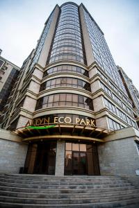 a building with a sign that reads new ego park at Altyn Eco Park in Astana