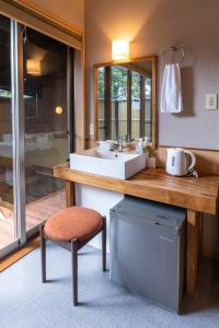 A seating area at ETAVIA Yufuin Kinrinko