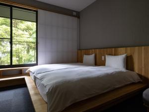 Krevet ili kreveti u jedinici u objektu 別府ホテル塒 Beppu Hotel Negura