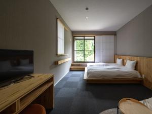 Krevet ili kreveti u jedinici u objektu 別府ホテル塒 Beppu Hotel Negura