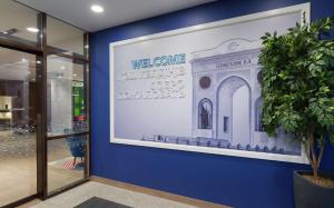 a framed picture of a building on a wall at Hampton By Hilton Astana Triumphal Arch in Astana