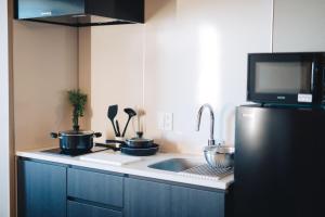 A kitchen or kitchenette at MIMARU SUITES KYOTO CENTRAL