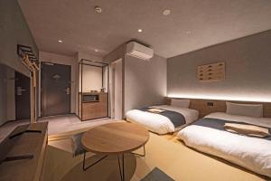 Llit o llits en una habitació de hotel around TAKAYAMA, Ascend Hotel Collection
