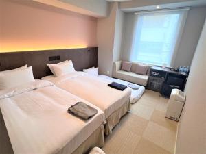 Hiyori Hotel Osaka Namba Station房間的床