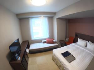 Hiyori Hotel Osaka Namba Station房間的床