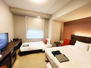 Hiyori Hotel Osaka Namba Station房間的床