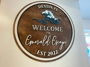 a sign that reads welcome to emerald cave east at Emerald Escape Peekaboo Beach View 3 Pools in Destin