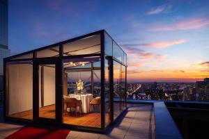 a dining table on the roof of a building at The Ritz-Carlton, Astana in Astana