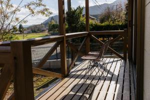 a chair sitting on a wooden deck with a view at Hakusyu - Vacation STAY 11460v in Aso