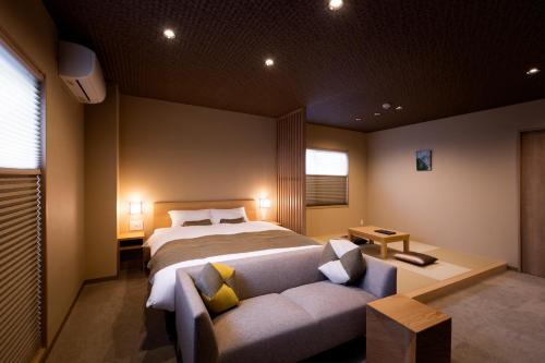 A bed or beds in a room at Rinn Kitagomon