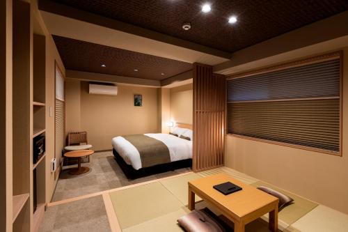 A bed or beds in a room at Rinn Kitagomon