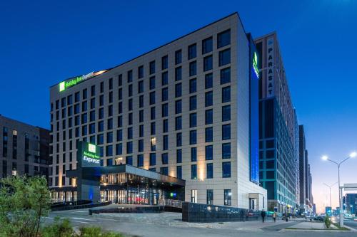 a large building in the middle of a city at Holiday Inn Express - Astana - Turan by IHG in Astana