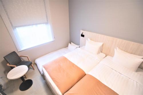 Hiyori Hotel Osaka Namba Station房間的床