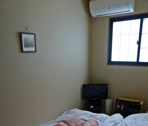 Televisi dan/atau pusat hiburan di Guesthouse Engawa