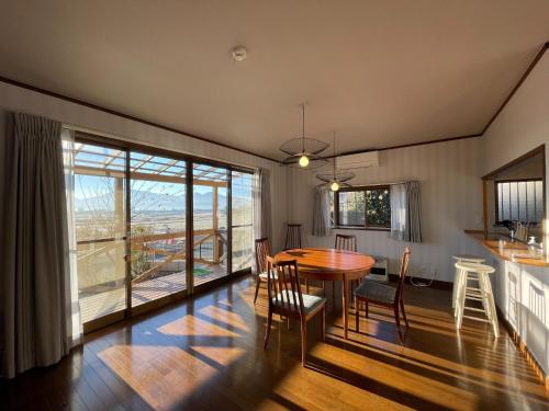 a kitchen and dining room with a table and chairs at Hakusyu - Vacation STAY 11460v in Aso