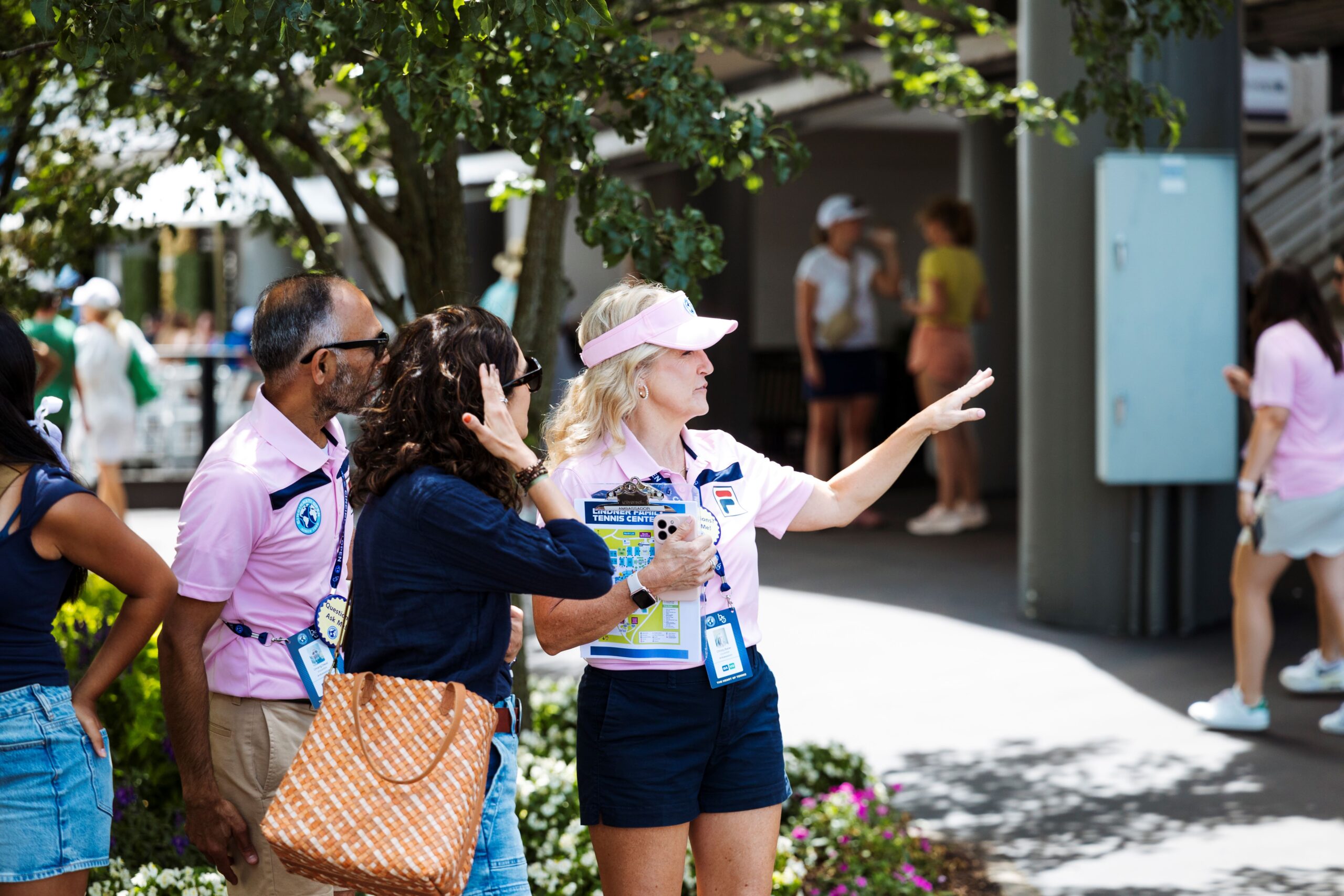 Volunteer in uniform helps patrons