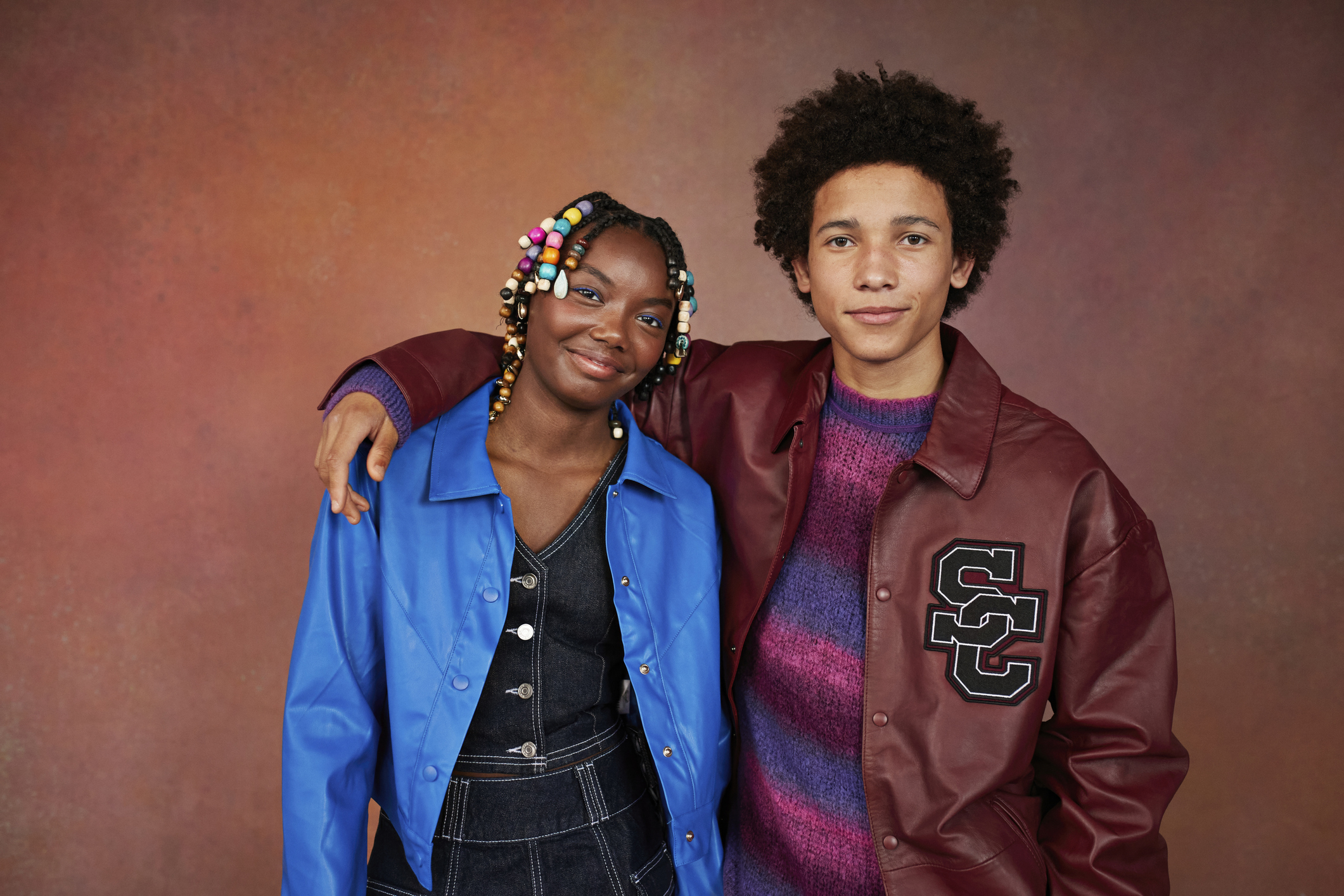 AFROTECH U: U Are The New Era. AFROTECH U is a digital one-stop shop for education that provides tools, resources, and insightful information geared toward helping young Black professionals progress while celebrating their achievements. The image shows a young woman with colorful beads in her braids and a young man in a leather jacket and sweater, standing against a brown background.