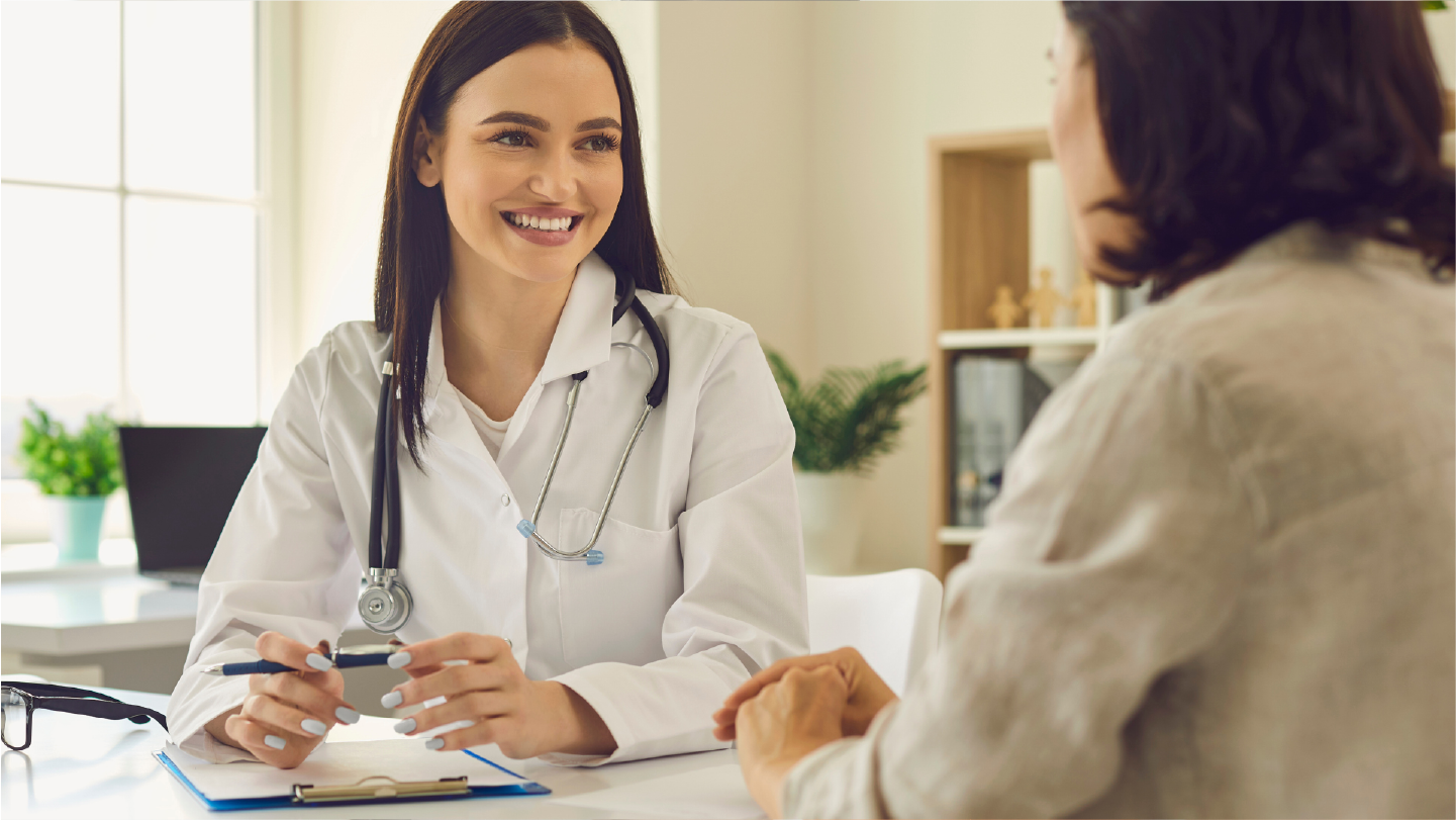 Doctor talking to patient without worrying about medical debt